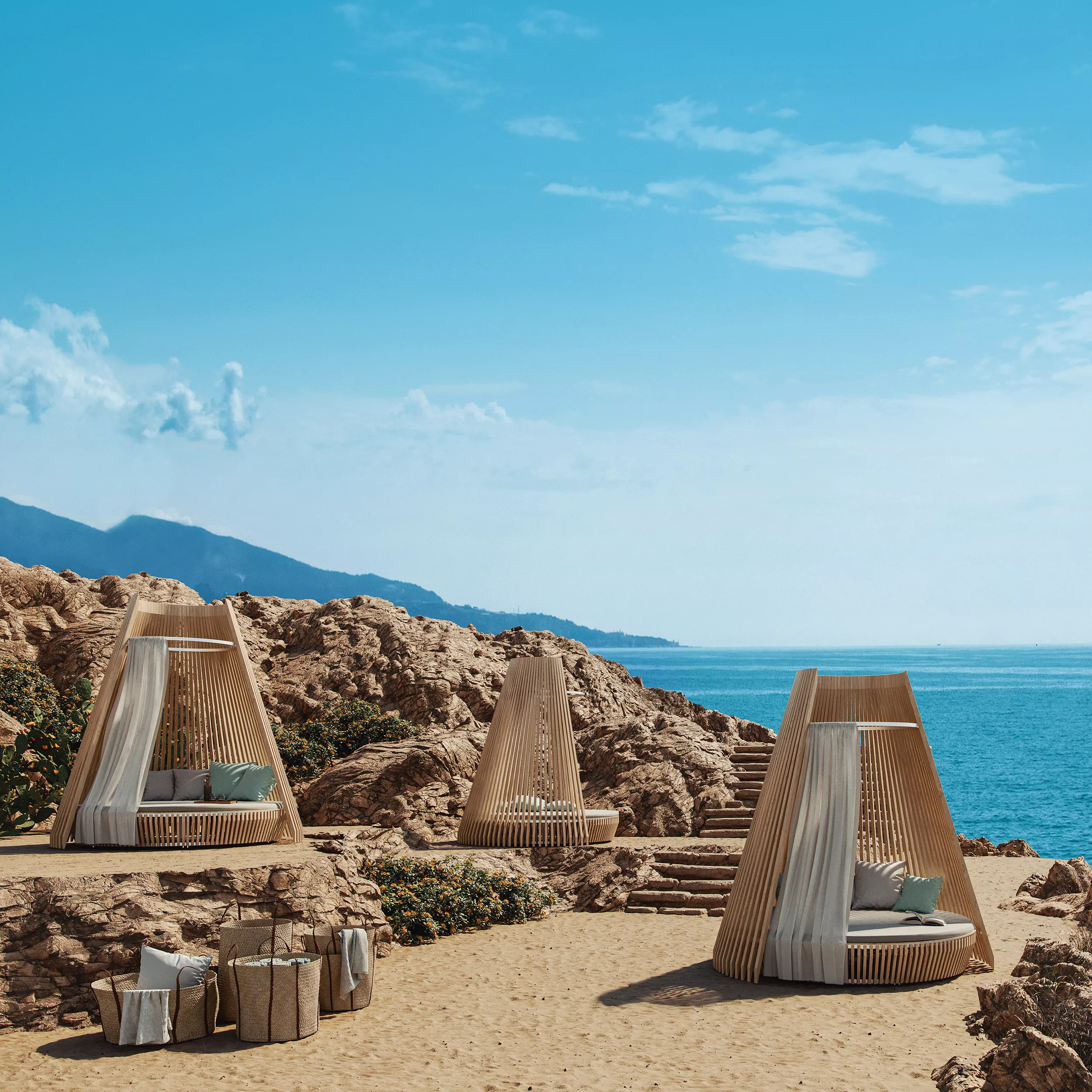 Ethimo Hut Loungebett in Naturtönen auf sandigem Strand mit Meerblick und Felsen im Hintergrund, stimmungsvolle Outdoor-Szene.